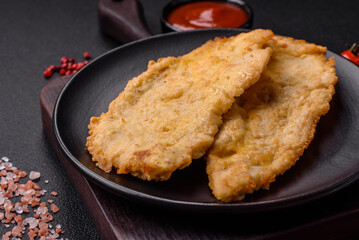 Delicious juicy chicken chops in batter with salt, spices and herbs