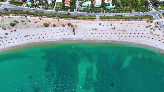Establishing aerial view of the beautiful city beach at Glyfada, southern suburb of Athens, Greece