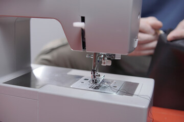 detail of sewing machine needle