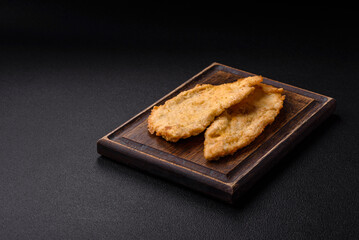 Delicious juicy chicken chops in batter with salt, spices and herbs