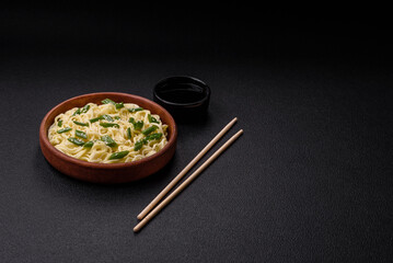 Delicious Asian cuisine dish with rice noodles, peppers, mushrooms and spices