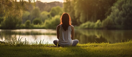 A serene woman enjoys the fresh air in a lush forest, with a blurred background perfect for a copy space image.