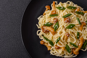 Delicious Asian cuisine dish with rice noodles, peppers, mushrooms and spices