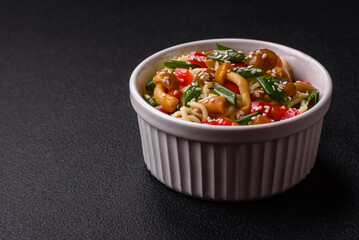 Delicious Asian cuisine dish with rice noodles, peppers, mushrooms and spices