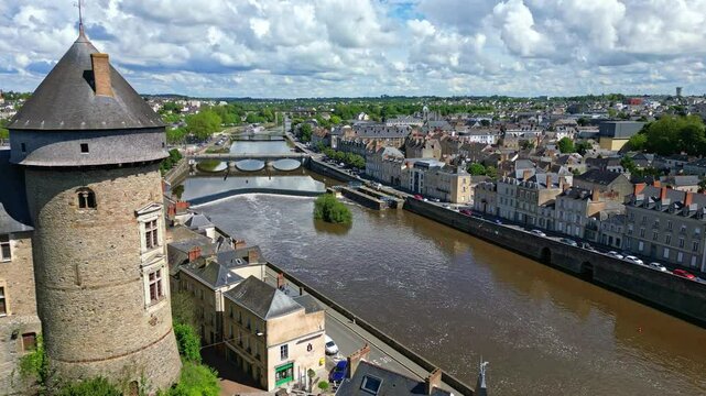 Chateau de Laval castle, riverside and bridges, France. Aerial drone forward