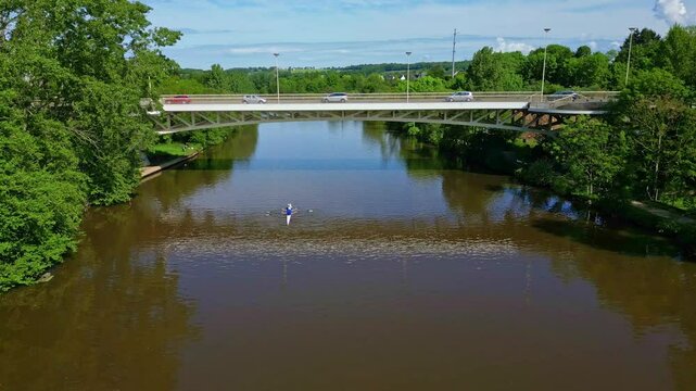 Pont de Pritz bridge over Mayenne River, border between Laval and Chang&eacute;, France. Aerial drone backward