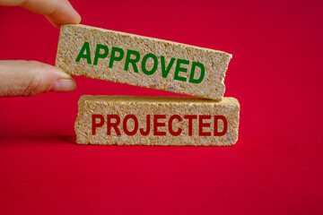 Concept words approved and rejected on beautiful brick blocks. Beautiful red background. Businessman hand. Business concept.