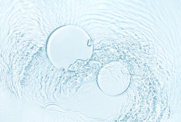 Cosmetic product presentation mockup scene made with two empty round glass podiums on blue water...