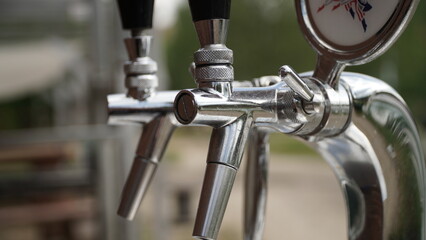 Close-Up of Silver Beer Taps from a Different Angle A close-up shot of silver beer taps taken from a different angle, revealing a new perspective on the intricate design and polished finish of the equ