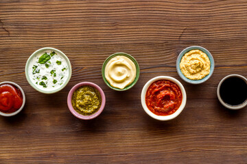 Bowls with various sauces for the meat or vegetables. Food background