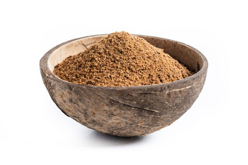 Coconut palm sugar in coconut bowl isolated on white background