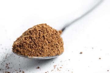 Coconut palm sugar isolated on white background