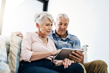 Tablet, browsing and mature couple in living room in house for online movie streaming on website....
