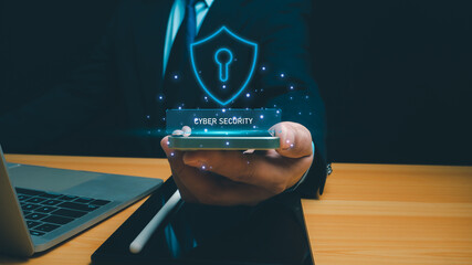 Cyber security technology concept, Businessman use phone and computer online showing protection...