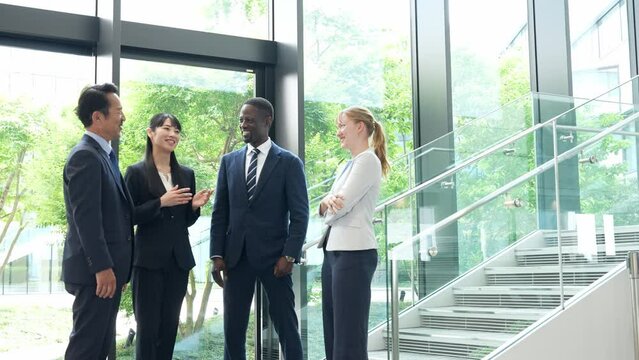 Group of multinational business people talking in a lobby