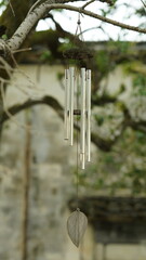 One windy bell hanging on the tree in the yard