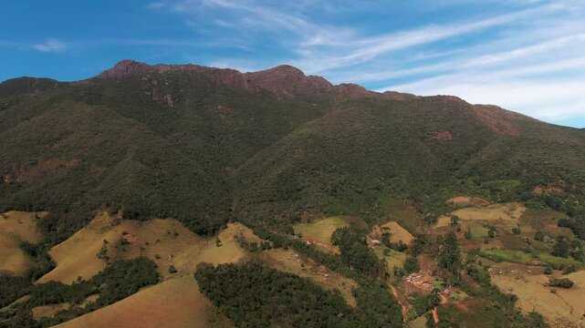 Drone aerial landscape pan of Pico dos Marins mountain range peak nature hiking trails summit Mantiqueira S&atilde;o Paulo Brazil South America travel tourism