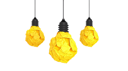 a group of yellow paper balls from a black light bulb