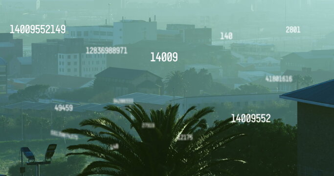 Image of numbers and data processing over cityscape