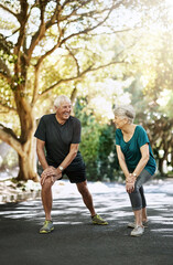 Outdoor, stretching and old couple with exercise, fitness and workout with challenge, healthy and energy. People in park, senior man and mature woman with training, wellness and cardio with balance