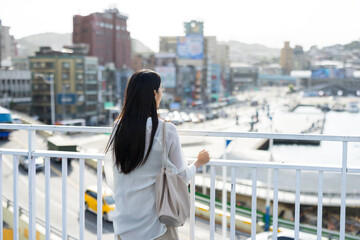 Woman travel in the Keelung pier