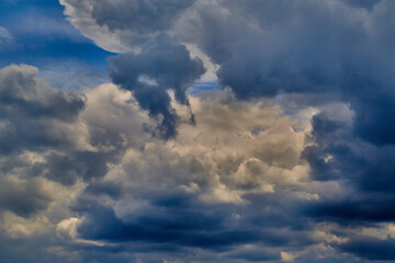 Bright sunlight in the clouds in the blue sky, light among the clouds