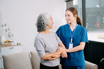  Young Caregiver doctor examine older patient use blood pressure gauge. woman therapist nurse at...