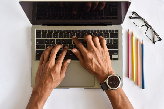 Asian man hand working with laptop flat lay view or from above shot