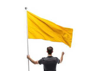 a man holding a yellow flag