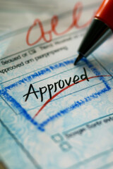 Obraz premium A close-up of an official document with a checkbox marked, signifying approval. The document might have a header like 