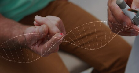 Image of spinning dna test over patient using glucose meter