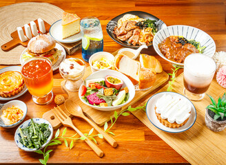 Vegetable and Fruit Salad, Lemon Cake and Tofu Pudding, lemon and Apple Pie, Curry Pork Chop Rice, BBQ rice, Roasted Pork Burger, Golden pomelo tea, Elderberry Sparkling Drink, Cocoa Ole served