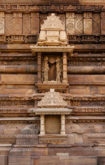 Ancient Sculptures remains and intricate designs on the wall of Vishwanath Temple  in the Khajuraho temple complex, India