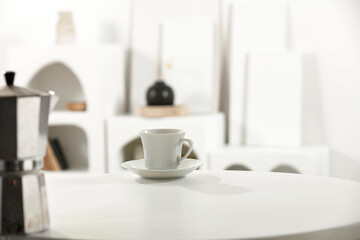 White desk of free space and kitchen interior with sun light. 