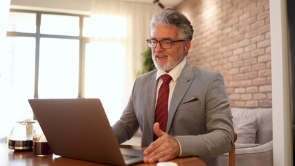 Mature businessman running online business from home