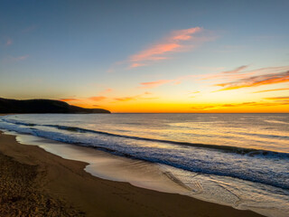 Sunrise at the seaside with high cloud