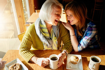 Senior woman, happy and daughter with laughing in cafe for memories or bonding with relax. Restaurant, coffee shop and discussion with people, conversation and smiling family with love in France.