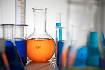 Laboratory glassware placed in a table with liquid sample