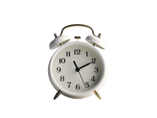 a white alarm clock with bells