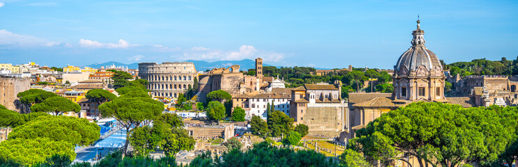 A panoramic view of the Roman Forum and Colosseum in Rome, Italy. The iconic amphitheater stands...
