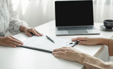HR Manager talks to job applicants for job interviews about careers and Her personal history in the...