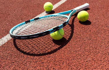 Tennis scene with balls, racquets and hard court surface corner lines