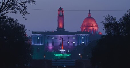 New Delhi, Delhi, India. Kartavya Path, Rajpath Area. Rashtrapati Bhavan - fountain, Bell tower, Central dome of Secretariat Building in evening night illumination lights lighting. City Central Park