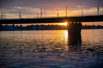 Obraz premium sunset over the river and a bridge