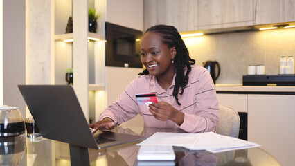 African American young woman shopping online at home