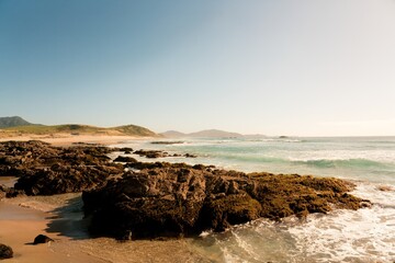 Waves hit the rocky beach