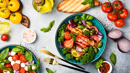 Vegetarian healthy salad with tomatoes, onions, parsley and basil. Vegetable food.