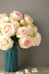 Bouquet of soft white roses in a vase. Floral still life with roses.