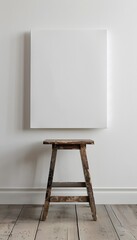 front view of one white blank canvas leaning against the wall 