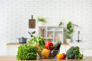 Different fresh vegetables on wooden kitchen counter